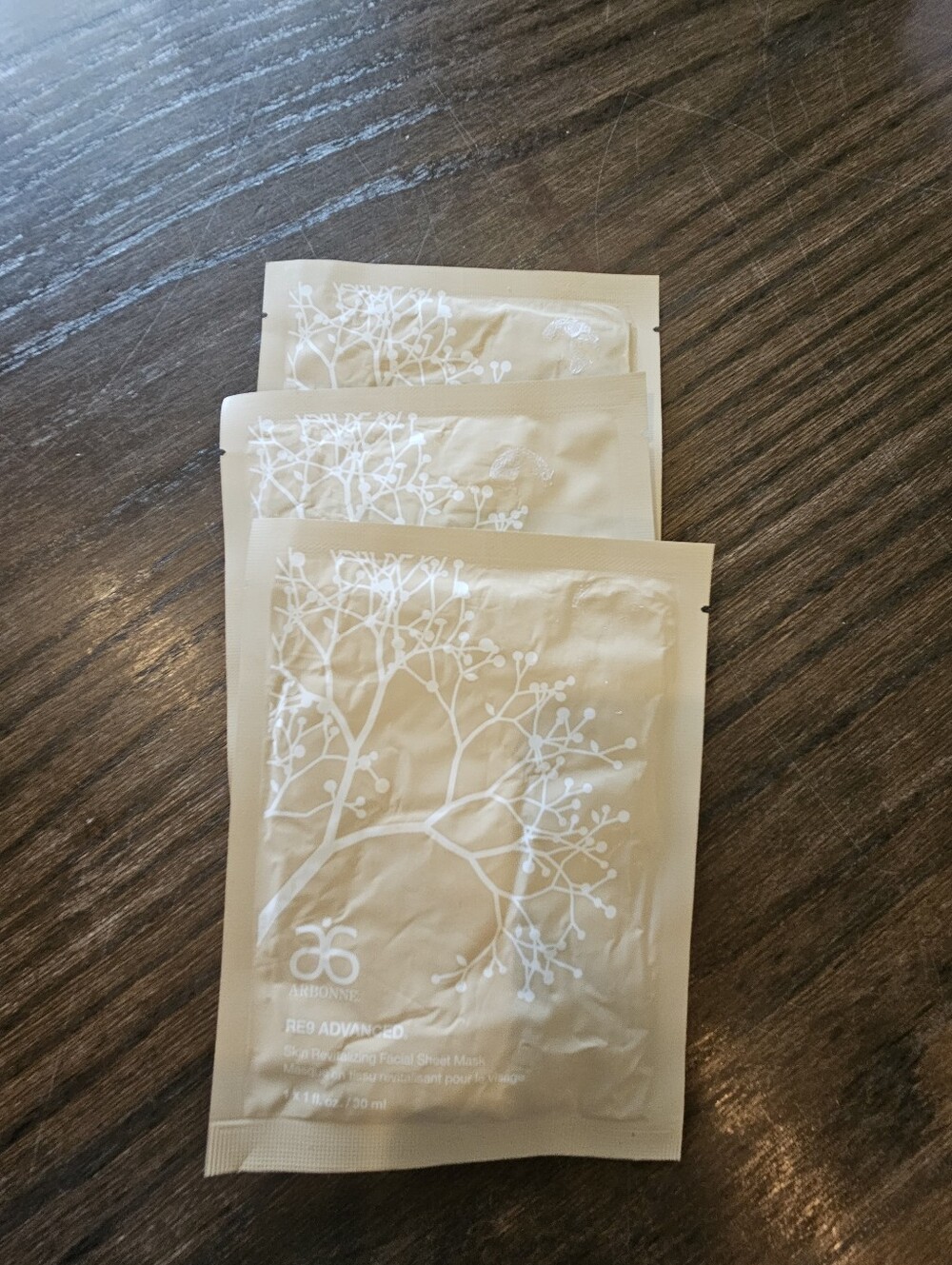 Arbonne Beige Single-Use Facial Sheet Masks with White Botanical Design (3 Pack)